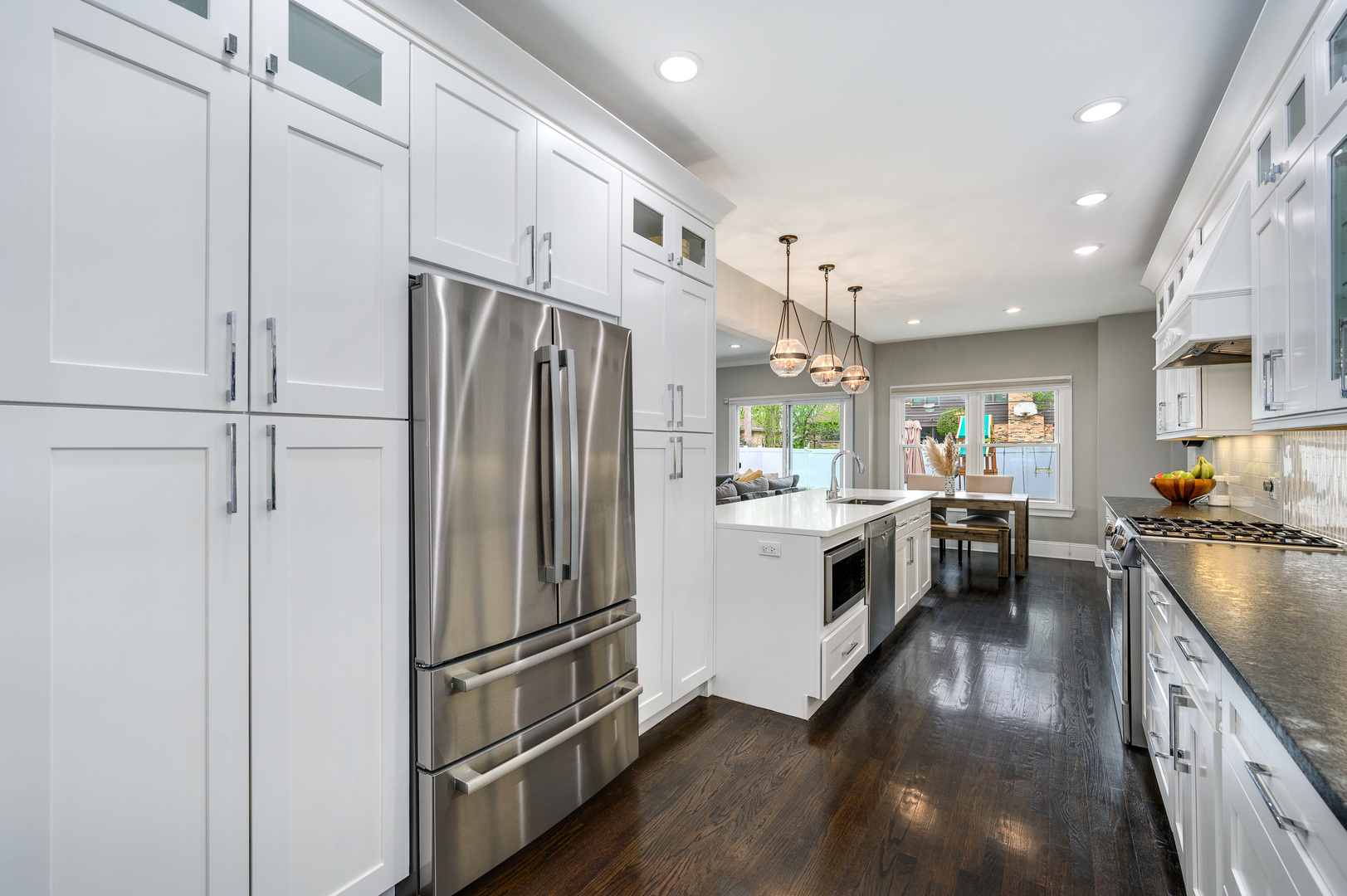 808 Rolling Pass Glenview, IL 60025 - Photo 8 of 33 a kitchen with a refrigerator a sink a stove and cabinets