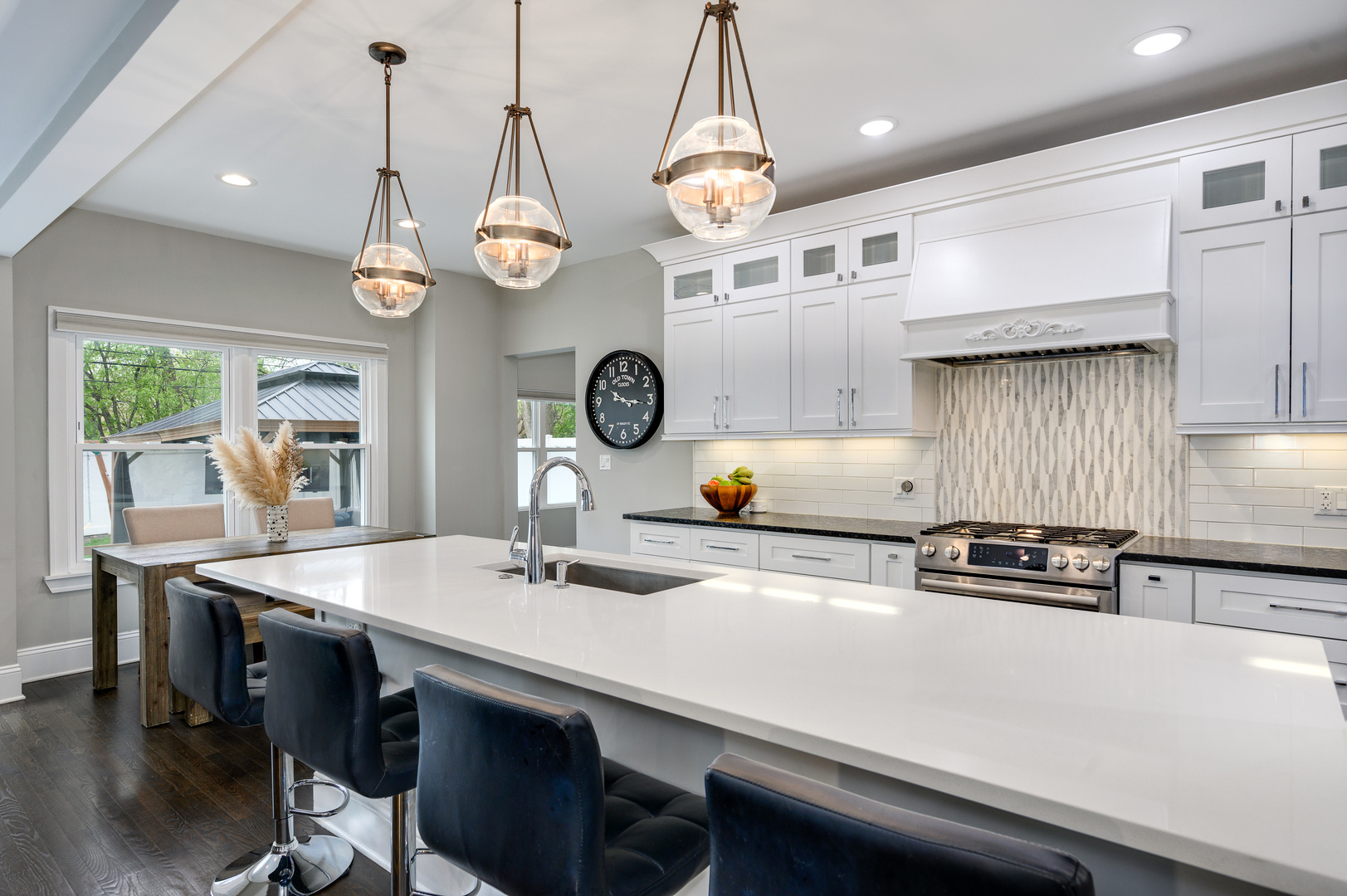 808 Rolling Pass Glenview, IL 60025 - Photo 9 of 33 a kitchen with a table and chairs in it