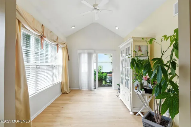 a view of entryway with wooden floor and a potted plant