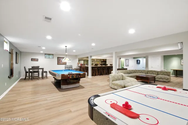 a living room with furniture and kitchen view