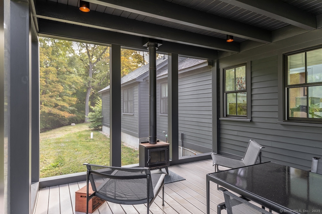 30 Knibloe Hill Road Sharon, CT 06069 - Photo 16 of 32 a view of a dining room with furniture and large windows