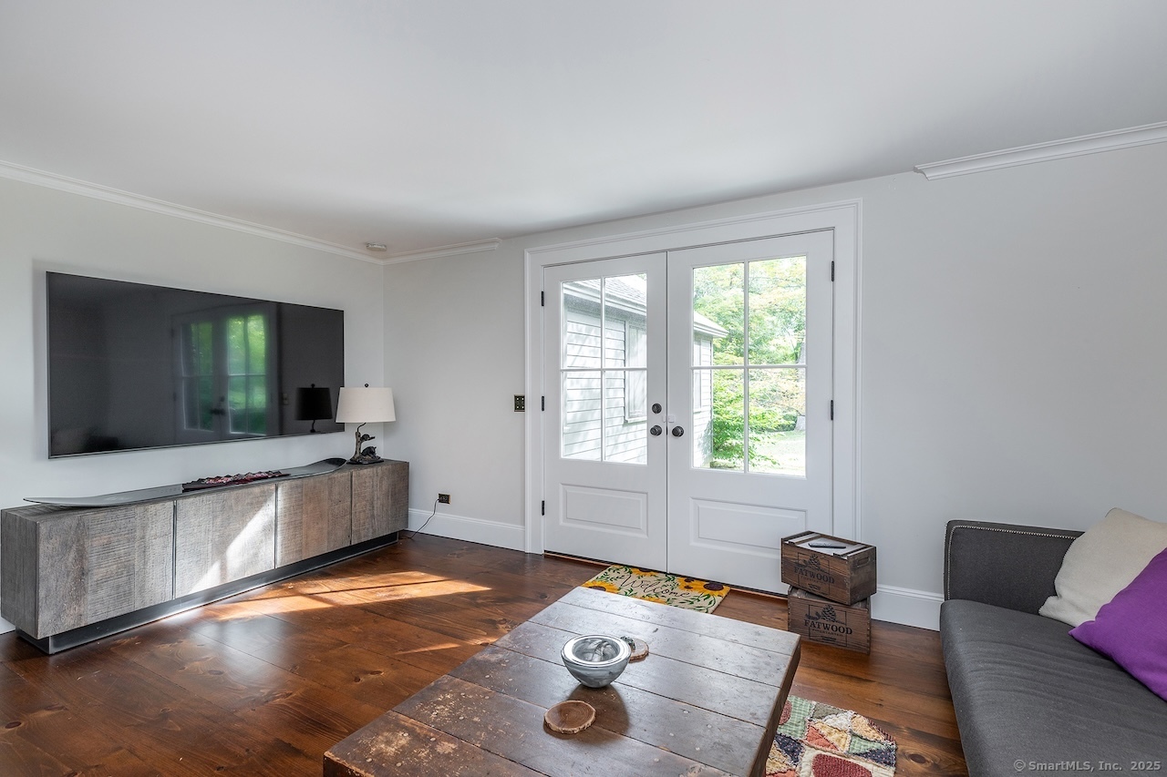 30 Knibloe Hill Road Sharon, CT 06069 - Photo 18 of 32 a living room with furniture and a flat screen tv