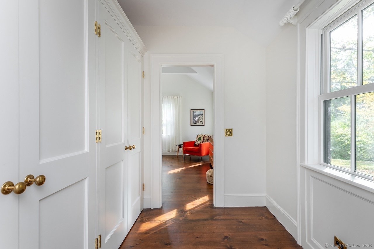 30 Knibloe Hill Road Sharon, CT 06069 - Photo 20 of 32 a view of a room that has a wooden floor and a window