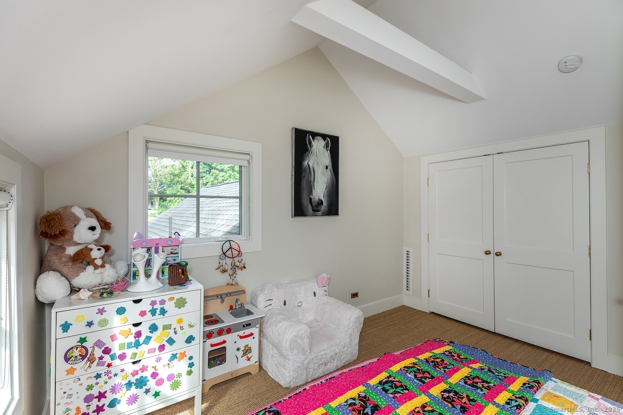 30 Knibloe Hill Road Sharon, CT 06069 - Photo 30 of 32 a bed room with furniture and a baby crib