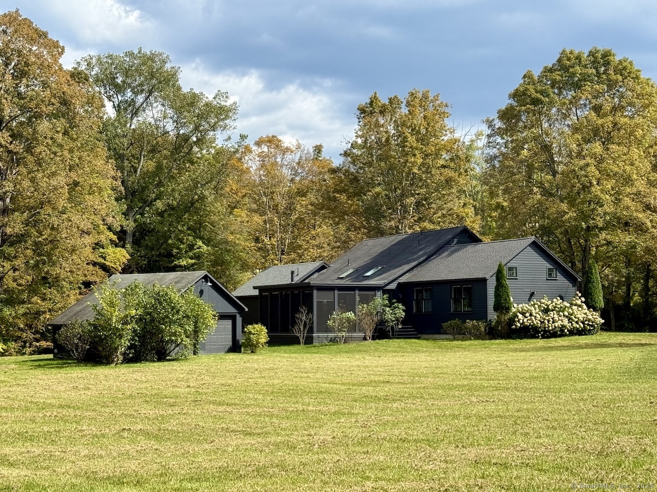 30 Knibloe Hill Road Sharon, CT 06069 - Photo 31 of 32 a front view of a house with a yard