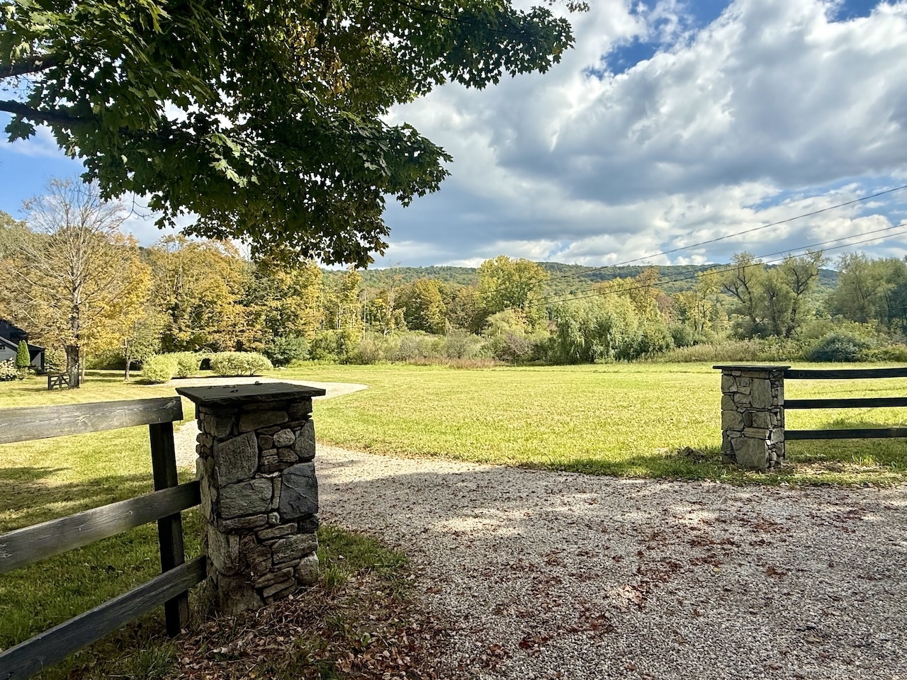 30 Knibloe Hill Road Sharon, CT 06069 - Photo 32 of 32 a view of a lake with a beach