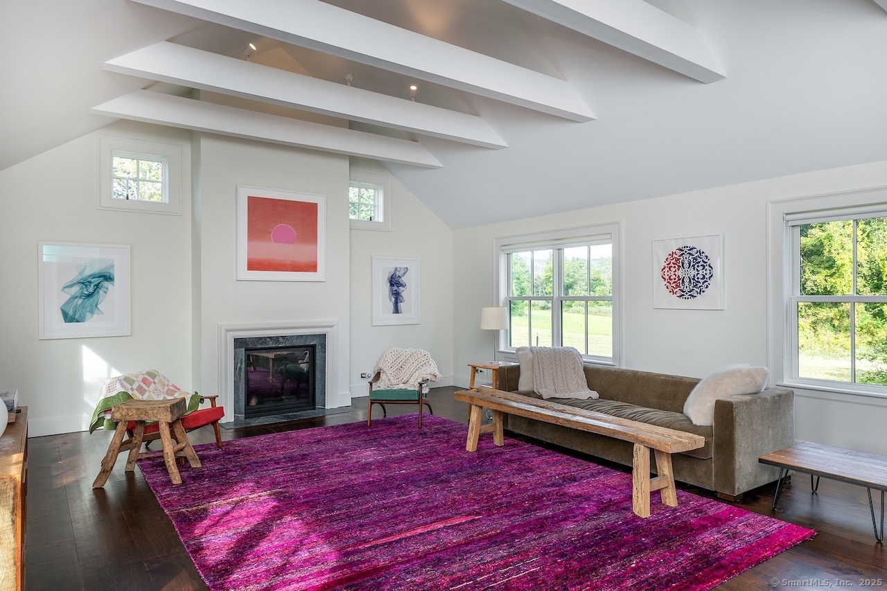 30 Knibloe Hill Road Sharon, CT 06069 - Photo 6 of 32 a living room with furniture a rug and a fireplace