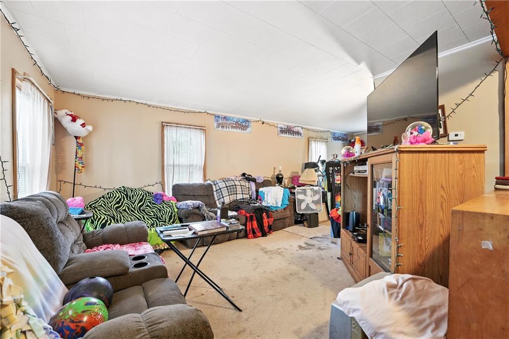 1401 Chestnut Street Franklin, PA 16323 - Photo 13 of 19 a living room with furniture and a floor to ceiling window