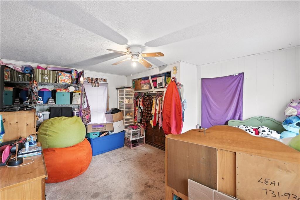 1401 Chestnut Street Franklin, PA 16323 - Photo 15 of 19 a bed room with a bed and a walk in closet