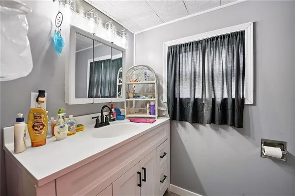 a bedroom with furniture and a gym equipment