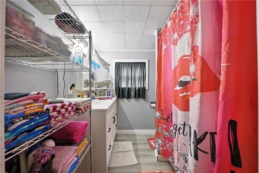 1401 Chestnut Street Franklin, PA 16323 - Photo 19 of 19 a view of walk in closet with clothes and shoes