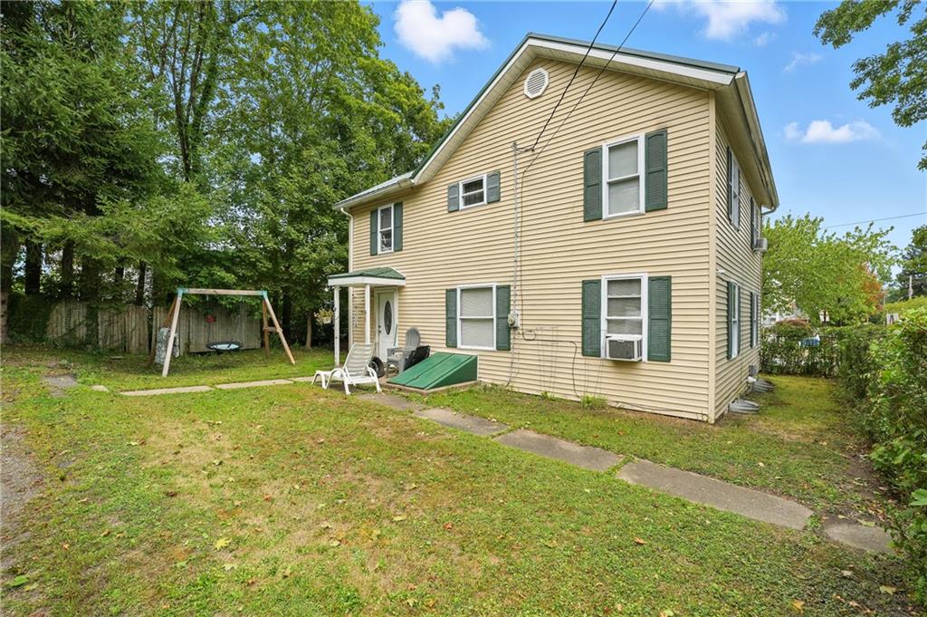 1401 Chestnut Street Franklin, PA 16323 - Photo 4 of 19 a view of backyard of house with wooden deck and seating space