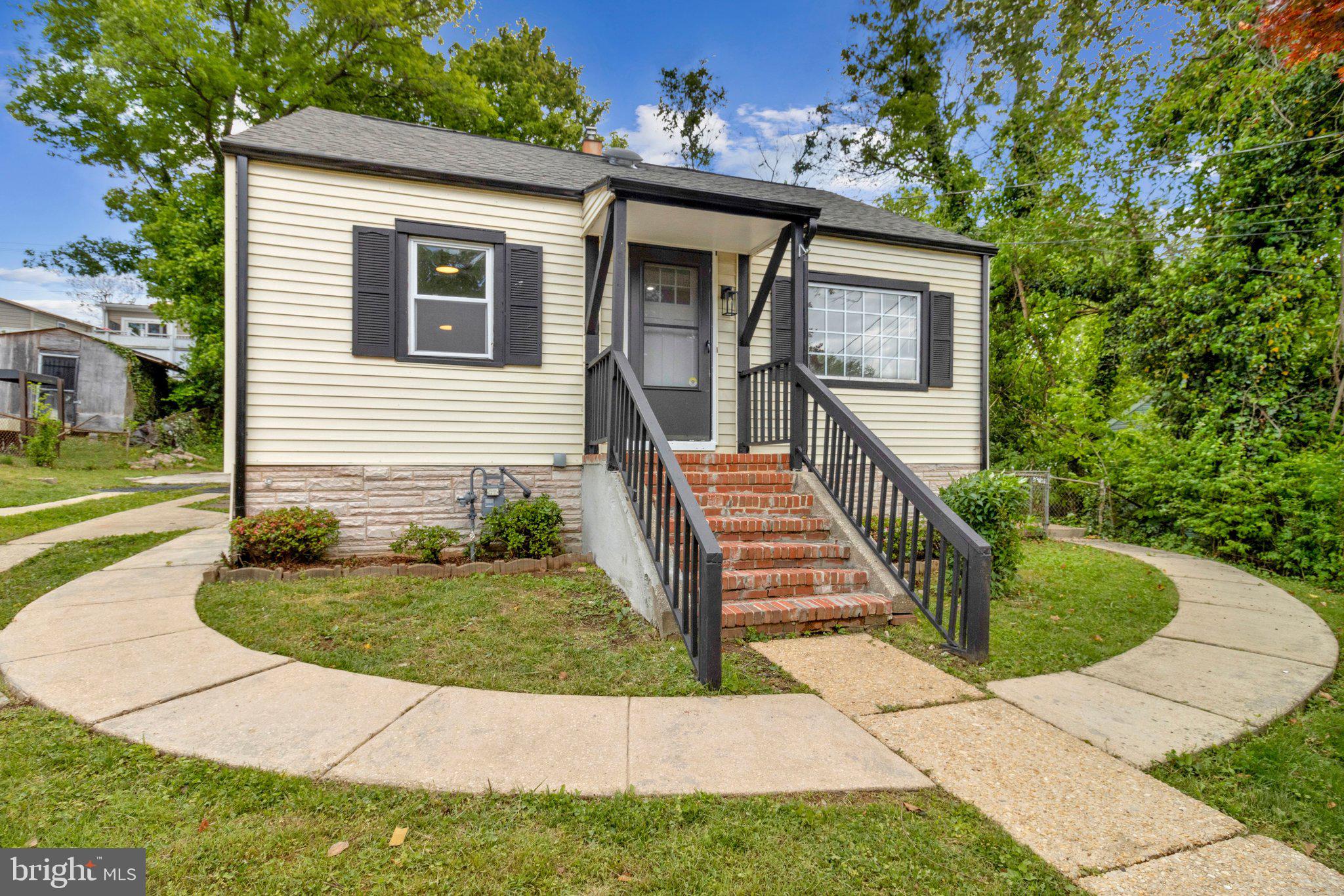 11515 Goodloe Road Silver Spring, MD 20906 - Photo 1 of 33 a front view of a house with garden