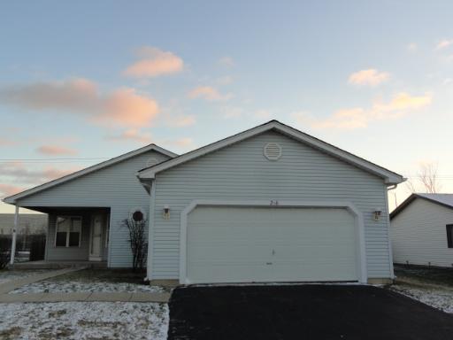 216 Homewood Drive Bolingbrook, IL 60440 - Photo 1 of 16 a front view of a house with garage
