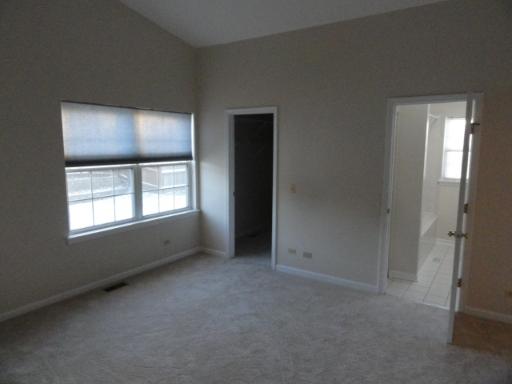 216 Homewood Drive Bolingbrook, IL 60440 - Photo 2 of 16 an empty room with windows and closet