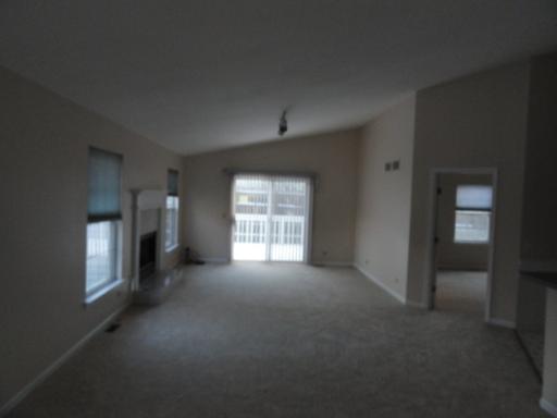 216 Homewood Drive Bolingbrook, IL 60440 - Photo 12 of 16 a view of empty room with windows