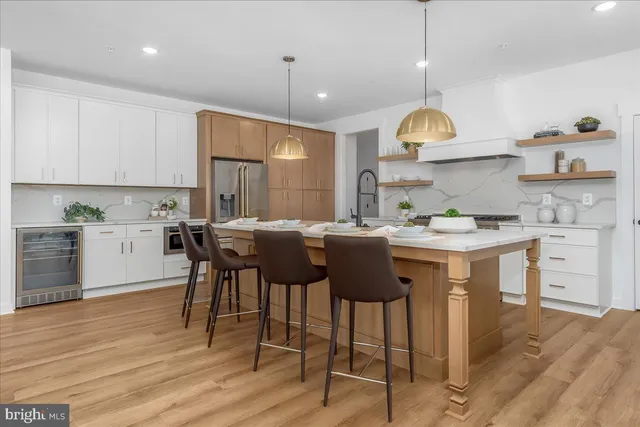 a kitchen with a sink cabinets and window
