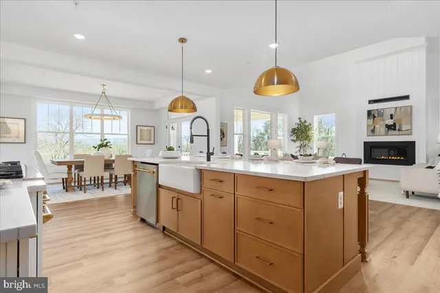 a kitchen with center island cabinets and window