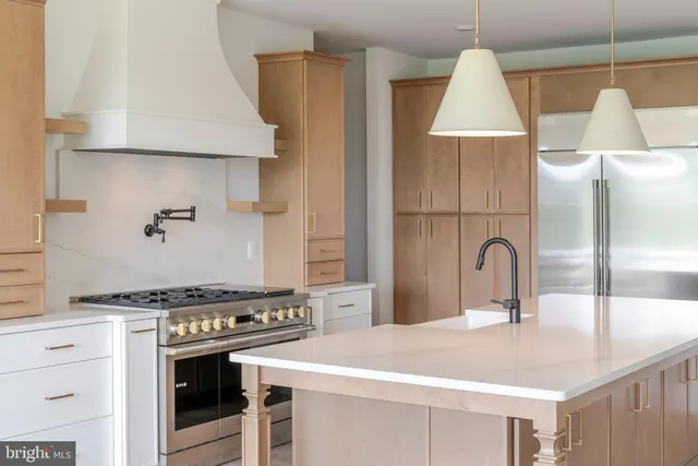 a kitchen with a stove and a sink