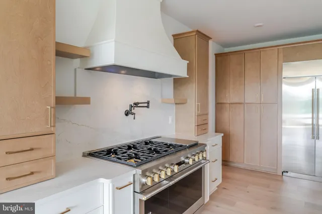a kitchen with a stove and a refrigerator