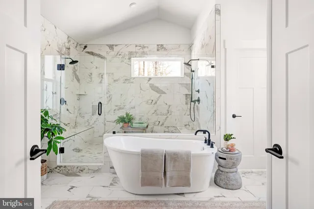 a white bath tub sitting in a bathroom