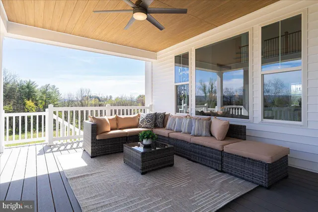 a view of a balcony with furniture