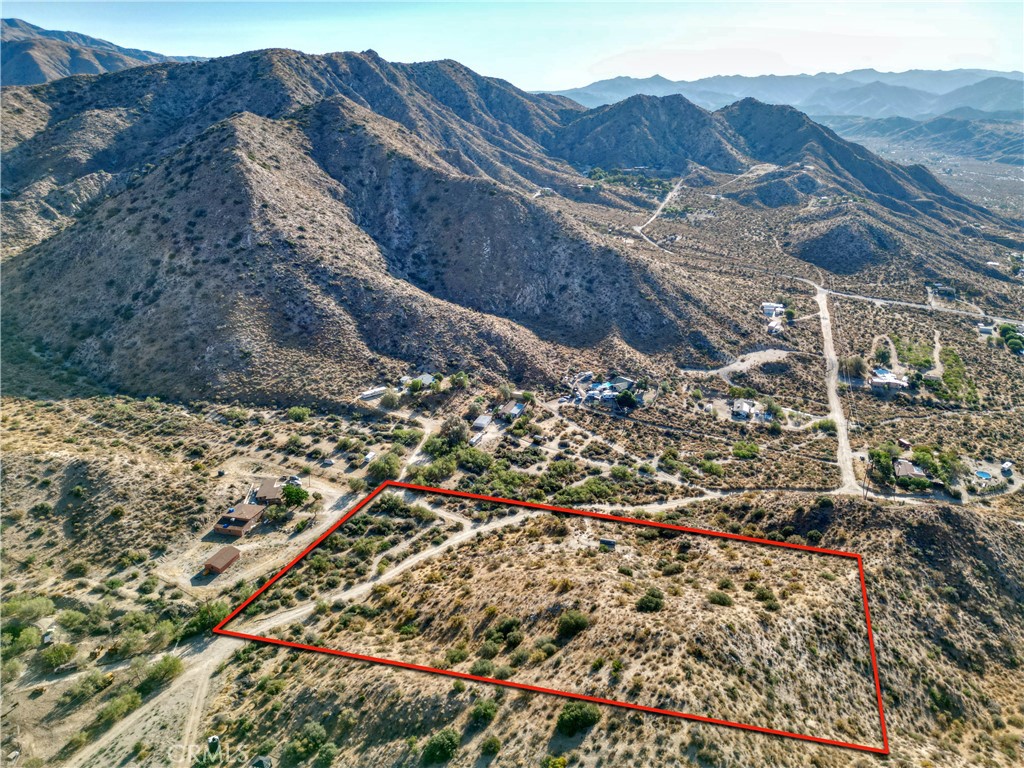 0 Pinon Avenue Morongo Valley, CA 92256 - Photo 22 of 24 a view of a house with a mountain