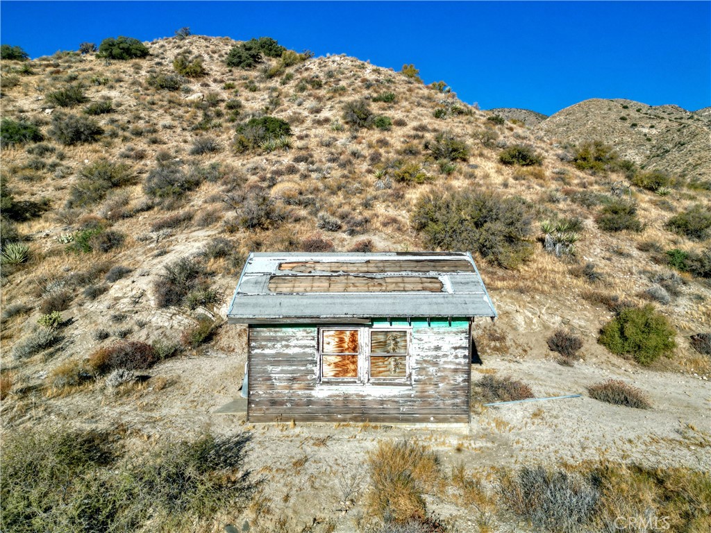 0 Pinon Avenue Morongo Valley, CA 92256 - Photo 6 of 24 a view of a building with mountains in the background
