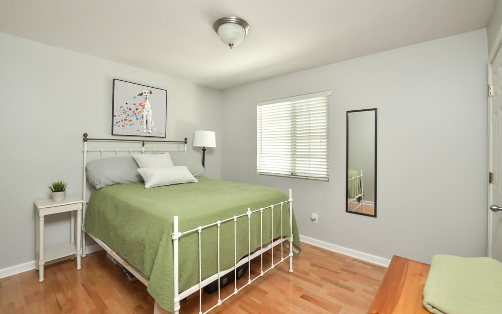 210 Sampson Street Northeast, Unit 5 Atlanta, GA 30312 - Photo 12 of 33 a bedroom with a bed and a window