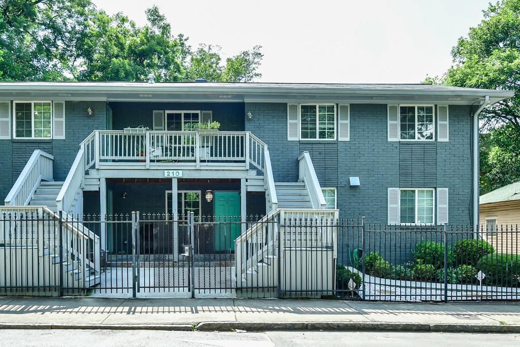 210 Sampson Street Northeast, Unit 5 Atlanta, GA 30312 - Photo 15 of 33 a front view of a house with a garden