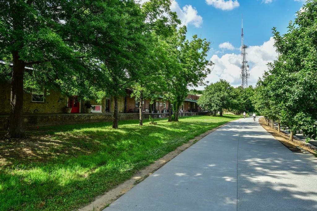 210 Sampson Street Northeast, Unit 5 Atlanta, GA 30312 - Photo 26 of 33 a view of a street with a big yard and large trees