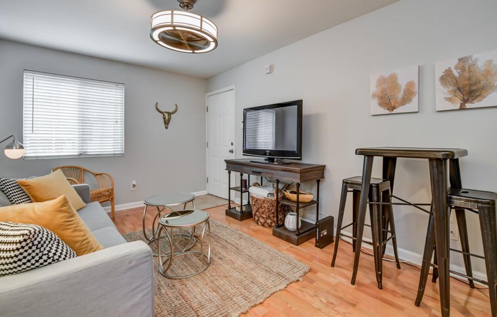 210 Sampson Street Northeast, Unit 5 Atlanta, GA 30312 - Photo 5 of 33 a view of a livingroom with furniture and a window