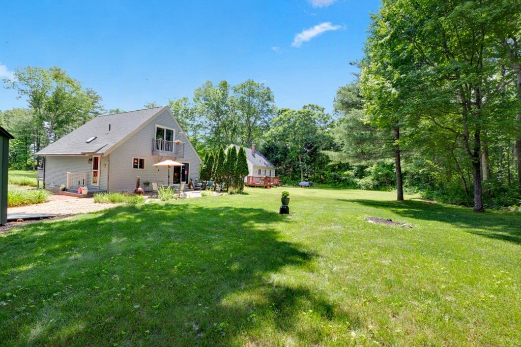 47 Horseshoe Circle Ware, MA 01082 - Photo 29 of 37 a view of a house with a backyard and a tree