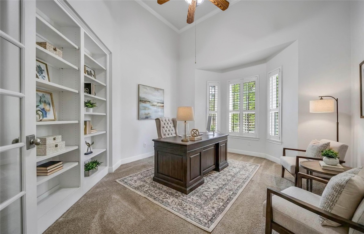 19 Millwright Place The Woodlands, TX 77382 - Photo 12 of 45 Work from home in style in this beautiful executive study boasting a wall of built-ins, a bay window with plantation shutters, and glass French Doors for privacy.