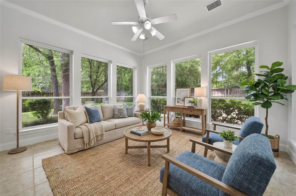 19 Millwright Place The Woodlands, TX 77382 - Photo 13 of 45 The sunroom is a gorgeous flex space off the main living areas. Use this as an additional living space with spectacular views of your private backyard oasis, a second study, a craft room, the possibilites are endless!