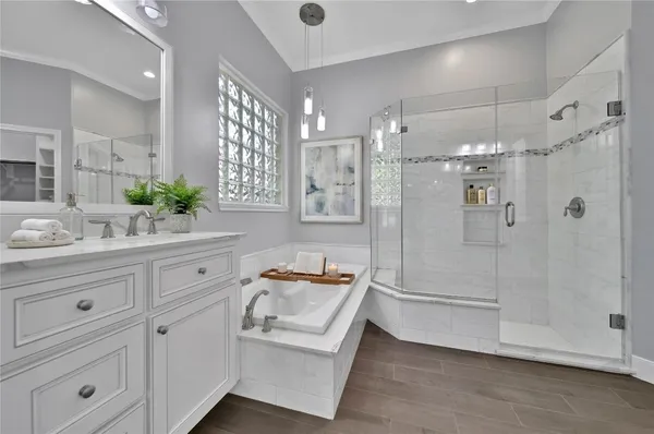 a bathroom with a double vanity sink and mirror