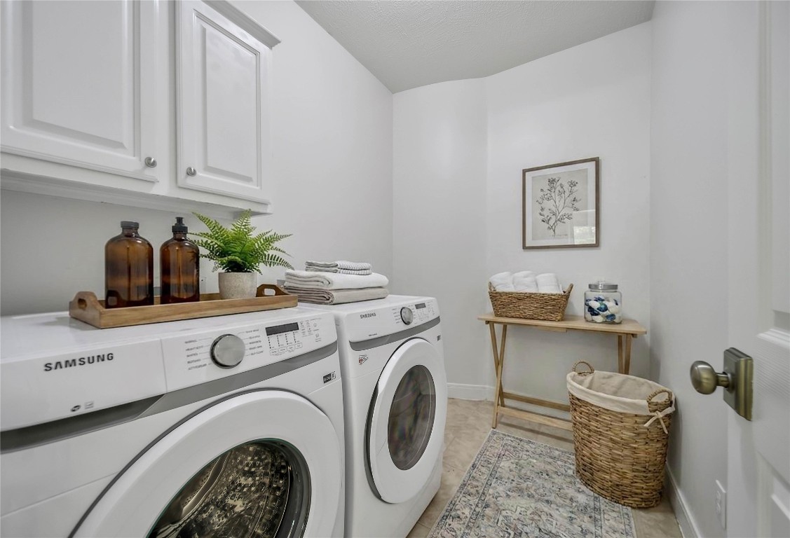 19 Millwright Place The Woodlands, TX 77382 - Photo 20 of 45 The laundry room is easy to love with storage cabinets and plenty of room for a second fridge or folding table.
