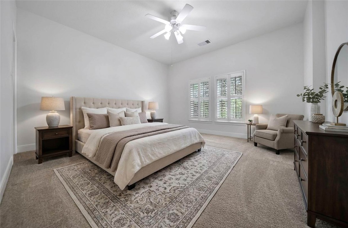 19 Millwright Place The Woodlands, TX 77382 - Photo 23 of 45 The secondary bedrooms are spacious and bright with sizeable walk-in closets.