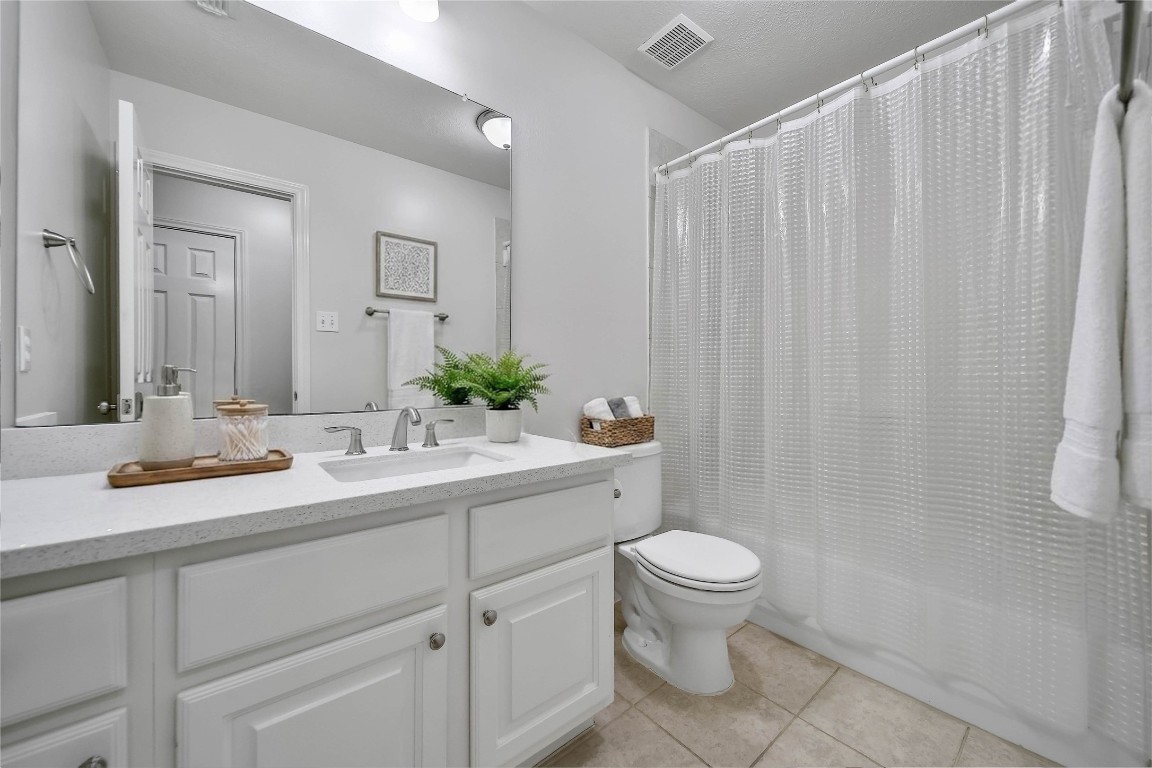 19 Millwright Place The Woodlands, TX 77382 - Photo 24 of 45 There is a hallway half bath dedicated to this bedroom, but easily accessible from the gameroom. A linen closet outside is appreciated for storage.