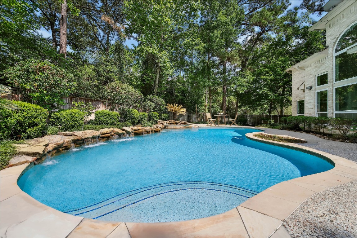 19 Millwright Place The Woodlands, TX 77382 - Photo 3 of 45 Enjoy a breathtaking Pool & Spa in your own backyard with no rear neighbors!