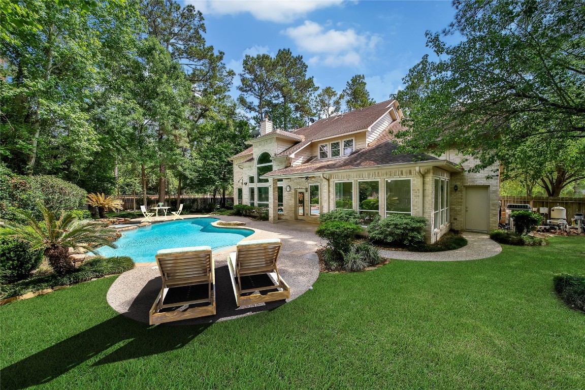 19 Millwright Place The Woodlands, TX 77382 - Photo 30 of 45 There's direct access to the backyard from the garage for easy storage.