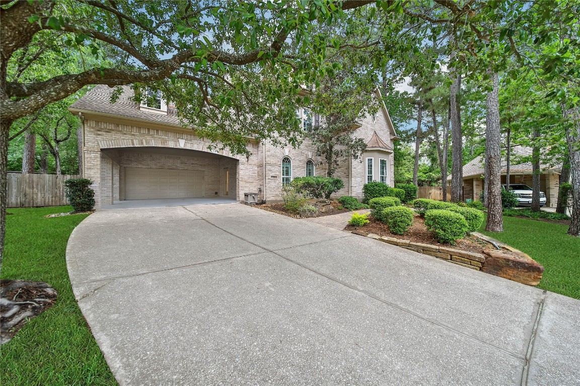 19 Millwright Place The Woodlands, TX 77382 - Photo 34 of 45 The 2 car garage and 2 car carport give you plenty of parking space and storage.