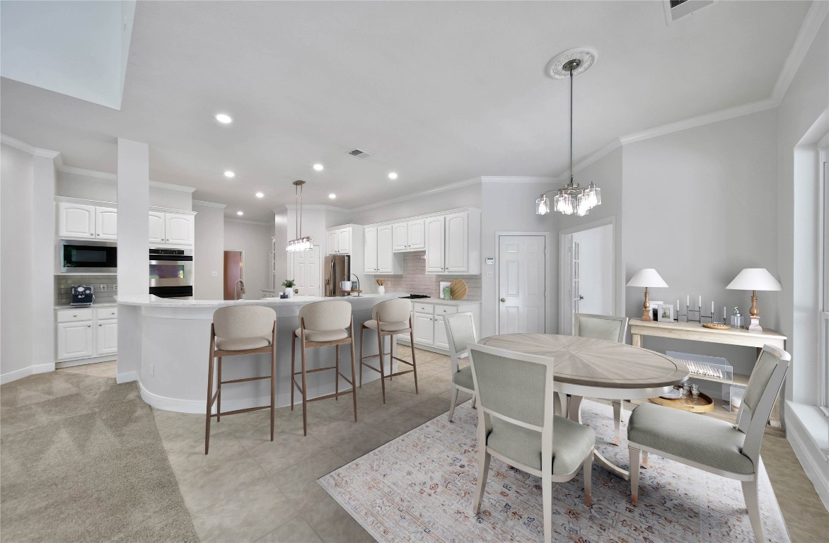 19 Millwright Place The Woodlands, TX 77382 - Photo 8 of 45 Enjoy everyday meals with your family in the casual dining area that's open to the kitchen and family room.