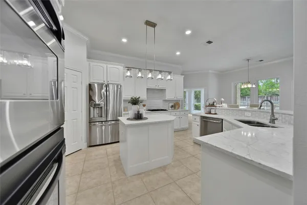 a spacious bathroom with double vanity sinks a bathtub and a shower