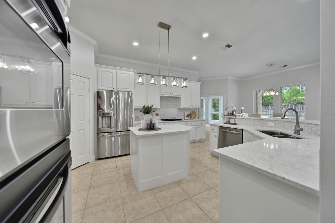 19 Millwright Place The Woodlands, TX 77382 - Photo 9 of 45 The kitchen is a delight for the chef in your family! Tons of counter space and storage including a walk-in pantry and butler's pantry.