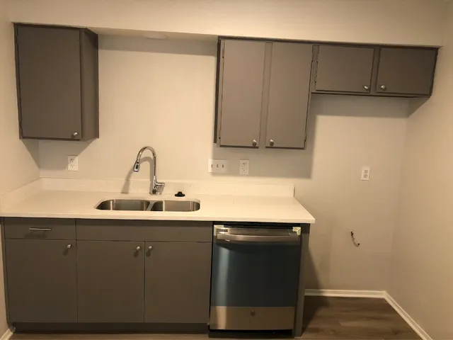 a kitchen with a sink and a cabinets