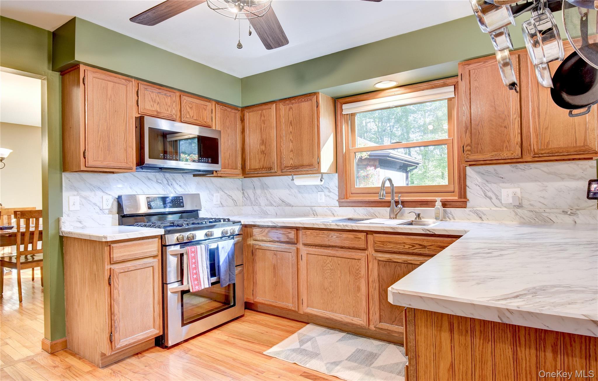 29 Valley View Road Bloomingburg, NY 12721 - Photo 7 of 50 a kitchen with stainless steel appliances granite countertop a stove a sink and a microwave