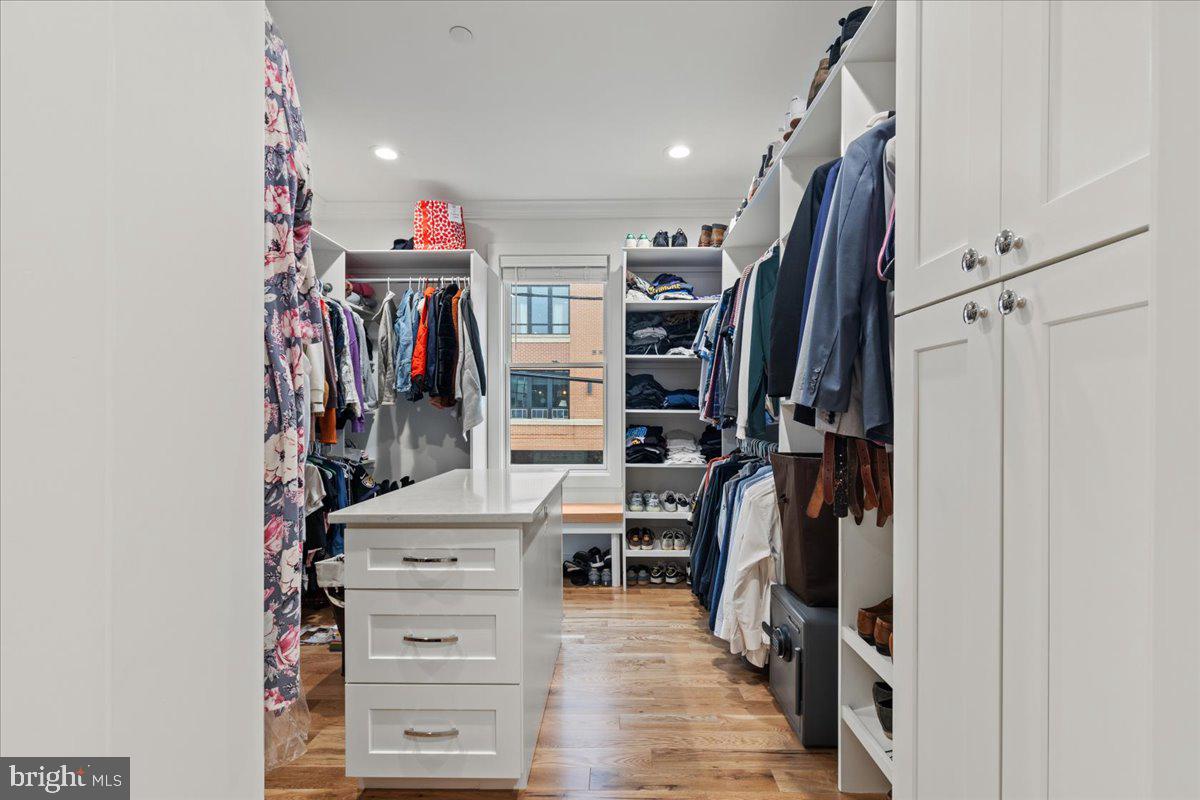 3424 Toone Street Baltimore, MD 21224 - Photo 13 of 87 a view of walk in closet with clothes and shoes