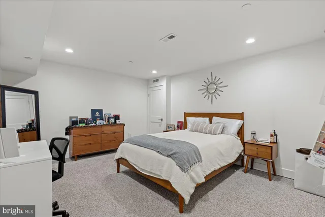 a view of a hallway with paintings on the wall