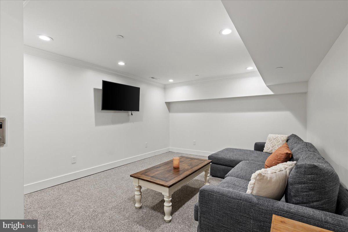 3424 Toone Street Baltimore, MD 21224 - Photo 20 of 87 a living room with furniture and a flat screen tv